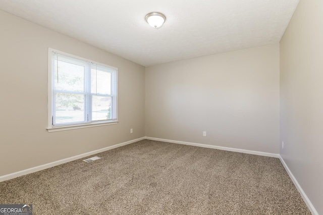 11102 Hunters Ln, Hampton, GA 30228 - carpeted spare room with baseboards