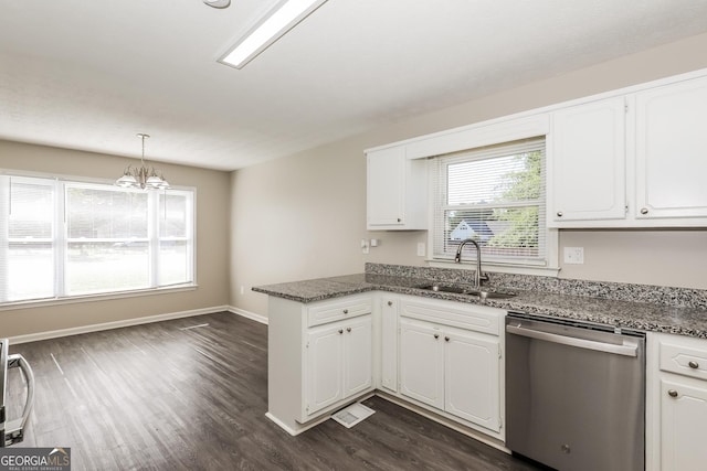 11102 Hunters Ln, Hampton, GA 30228 - kitchen with dishwasher, a sink, a peninsula, dark wood finished floors, and white cabinets