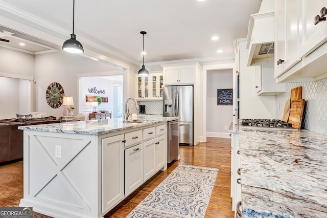 119 Waterview Cir, Newnan, GA 30263 - kitchen featuring a sink, appliances with stainless steel finishes, white cabinets, backsplash, and open floor plan