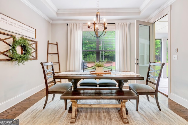 119 Waterview Cir, Newnan, GA 30263 - dining room featuring a chandelier, plenty of natural light, light wood-style floors, and ornamental molding