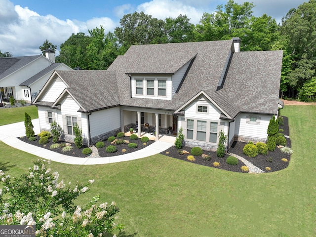 119 Waterview Cir, Newnan, GA 30263 - view of front of house with stone siding, roof with shingles, and a front yard