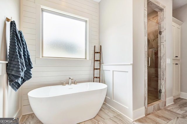 119 Waterview Cir, Newnan, GA 30263 - full bathroom featuring marble look tile flooring, a freestanding bath, and a stall shower
