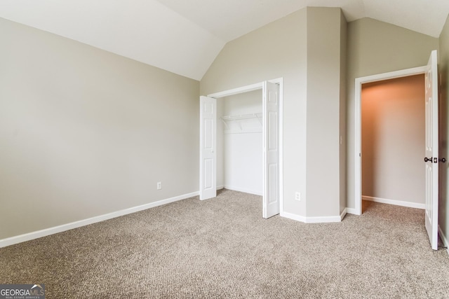 100 Inland Cir, Newnan, GA 30263 - unfurnished bedroom with vaulted ceiling, carpet flooring, baseboards, and a closet