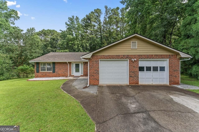 1738 Sherry Ln, Jonesboro, GA 30236 - ranch-style home with asphalt driveway, a front yard, a garage, and brick siding