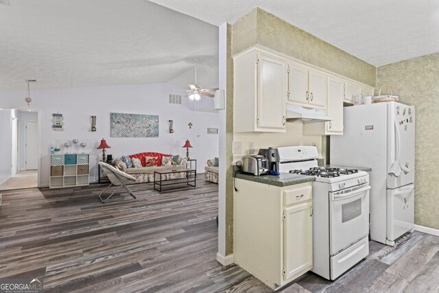 1738 Sherry Ln, Jonesboro, GA 30236 - kitchen featuring white appliances, under cabinet range hood, dark wood-type flooring, a ceiling fan, and open floor plan