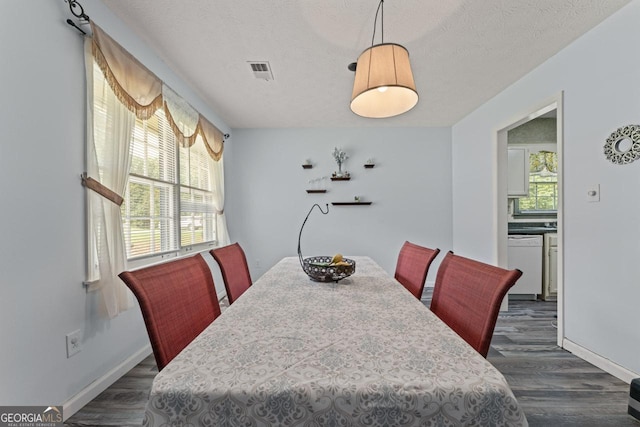 1738 Sherry Ln, Jonesboro, GA 30236 - dining area with dark wood finished floors and a textured ceiling