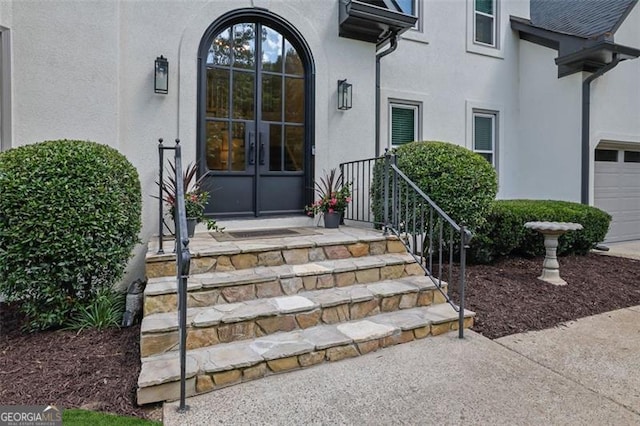 525 Old Path Xing, Roswell, GA 30075 - entrance to property featuring stucco siding, french doors, and a garage