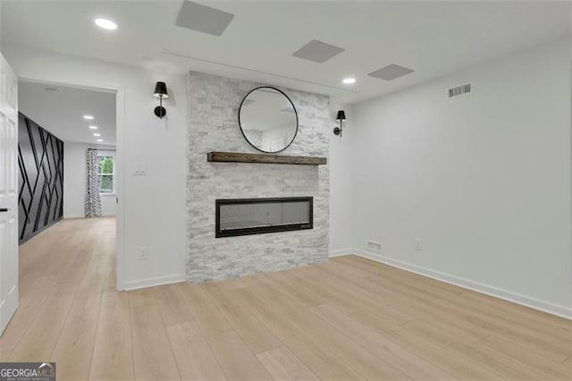 525 Old Path Xing, Roswell, GA 30075 - unfurnished living room featuring light wood-type flooring, a fireplace, and recessed lighting