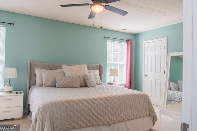 4336 Thorngate Ln, Acworth, GA 30101 - bedroom featuring light carpet and a ceiling fan