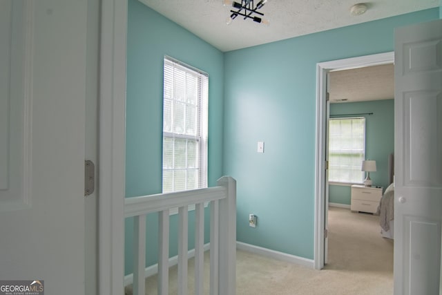 4336 Thorngate Ln, Acworth, GA 30101 - corridor with light carpet and a textured ceiling