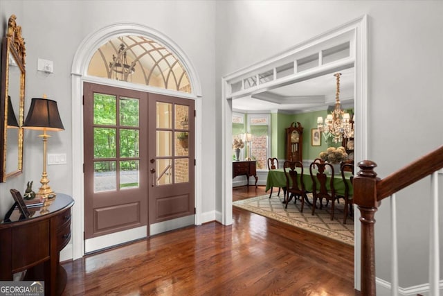 771 Rattlesnake Rdg, Dawsonville, GA 30534 - entrance foyer featuring french doors, a chandelier, wood finished floors, plenty of natural light, and ornamental molding