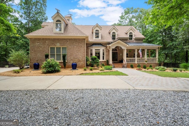 771 Rattlesnake Rdg, Dawsonville, GA 30534 - view of front of property featuring covered porch, brick siding, and roof with shingles