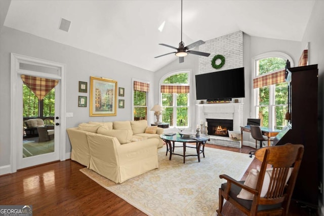 771 Rattlesnake Rdg, Dawsonville, GA 30534 - living room with lofted ceiling, ceiling fan, a fireplace, wood finished floors, and plenty of natural light
