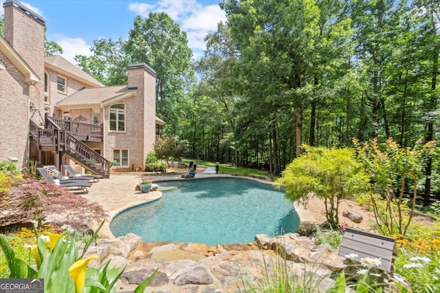 771 Rattlesnake Rdg, Dawsonville, GA 30534 - outdoor pool featuring stairs, a patio, and a deck