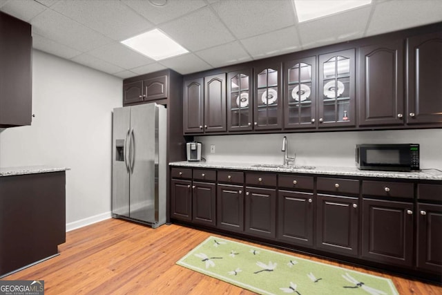 771 Rattlesnake Rdg, Dawsonville, GA 30534 - kitchen featuring stainless steel fridge, light wood-style floors, dark brown cabinetry, light stone countertops, and a drop ceiling