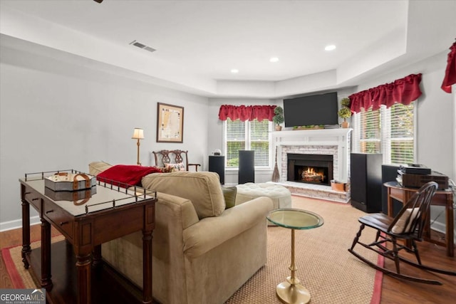 771 Rattlesnake Rdg, Dawsonville, GA 30534 - living room with a tray ceiling, wood finished floors, a fireplace, and recessed lighting