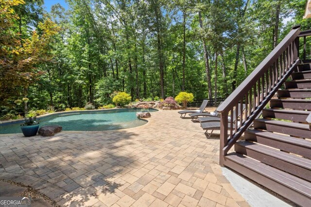 771 Rattlesnake Rdg, Dawsonville, GA 30534 - outdoor pool with stairway and a patio