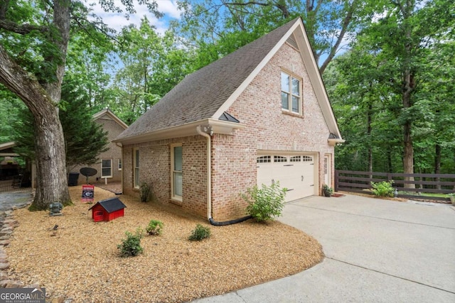 771 Rattlesnake Rdg, Dawsonville, GA 30534 - view of home's exterior with brick siding, roof with shingles, and driveway