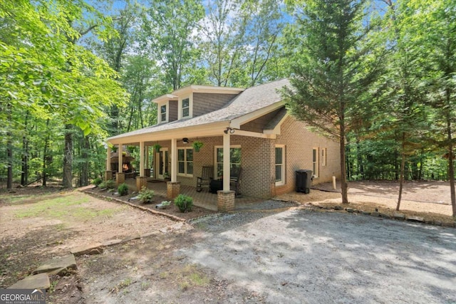 771 Rattlesnake Rdg, Dawsonville, GA 30534 - view of front of property featuring a ceiling fan, brick siding, a shingled roof, and a patio