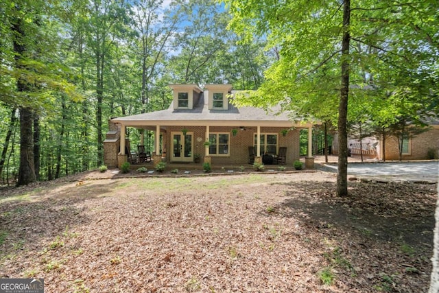 771 Rattlesnake Rdg, Dawsonville, GA 30534 - view of front facade with french doors, brick siding, and a porch