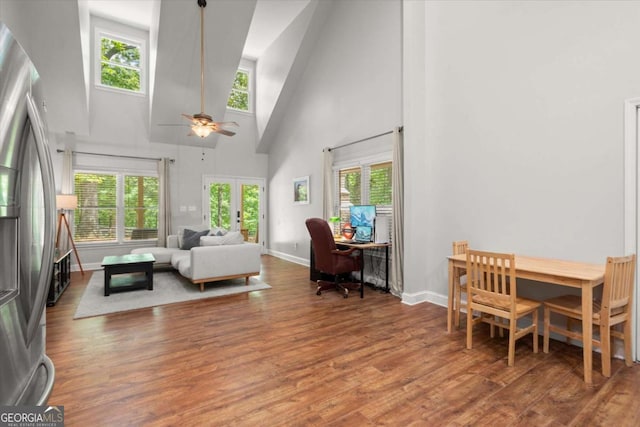 771 Rattlesnake Rdg, Dawsonville, GA 30534 - living area featuring high vaulted ceiling, wood finished floors, plenty of natural light, and ceiling fan