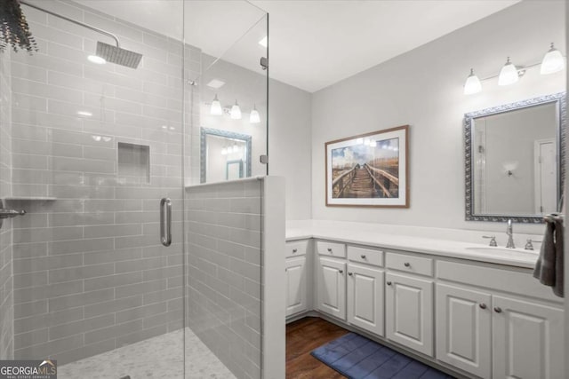 771 Rattlesnake Rdg, Dawsonville, GA 30534 - full bath with a shower stall, vanity, and wood finished floors