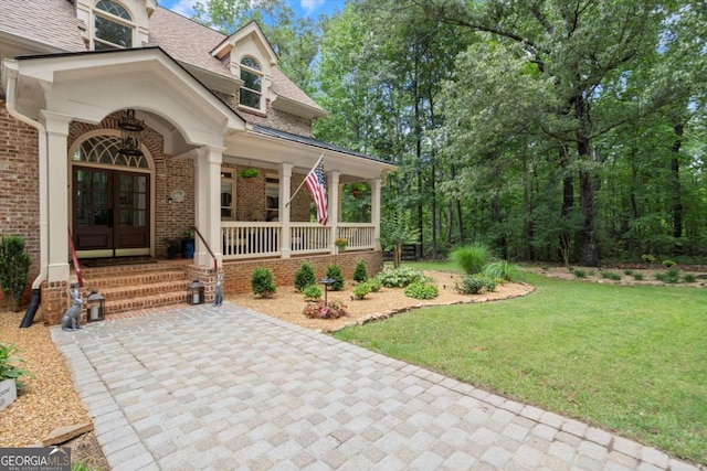 771 Rattlesnake Rdg, Dawsonville, GA 30534 - entrance to property with brick siding, covered porch, a lawn, and roof with shingles