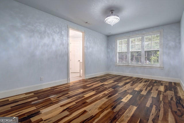 1000 Three Notch Rd, Buckhead, GA 30625 - spare room featuring wood finished floors and a chandelier