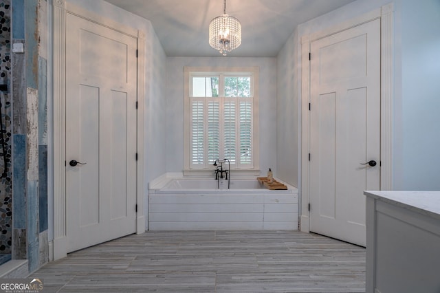 1000 Three Notch Rd, Buckhead, GA 30625 - bathroom with a garden tub, a chandelier, wood finished floors, and vanity