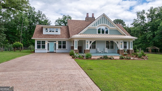 1000 Three Notch Rd, Buckhead, GA 30625 - view of front of house featuring covered porch, a front lawn, decorative driveway, a chimney, and roof with shingles