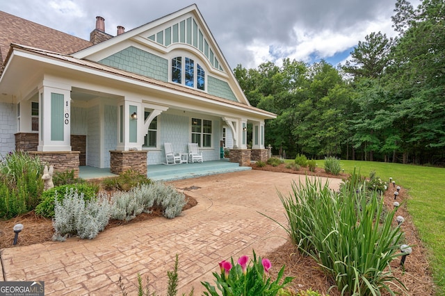 1000 Three Notch Rd, Buckhead, GA 30625 - back of property featuring covered porch, a chimney, and a yard