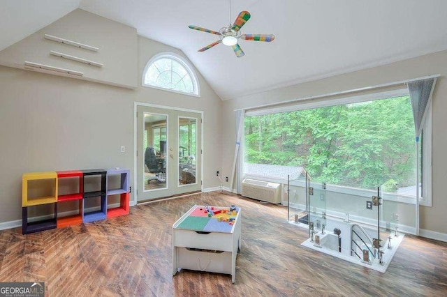 3493 Wood Acres Blvd, Duluth, GA 30096 - sitting room with a ceiling fan, an AC wall unit, high vaulted ceiling, baseboards, and french doors