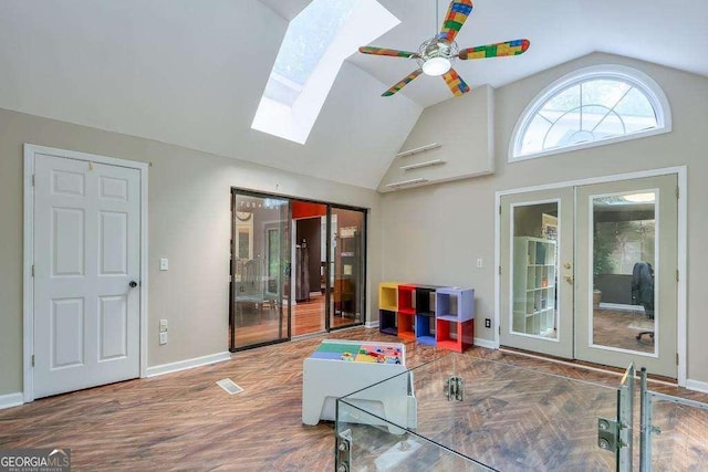 3493 Wood Acres Blvd, Duluth, GA 30096 - living area with french doors, ceiling fan, a skylight, baseboards, and high vaulted ceiling