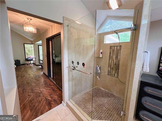 3493 Wood Acres Blvd, Duluth, GA 30096 - bathroom with lofted ceiling, plenty of natural light, a shower stall, and a chandelier
