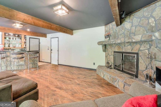 3493 Wood Acres Blvd, Duluth, GA 30096 - living area with beamed ceiling and a stone fireplace