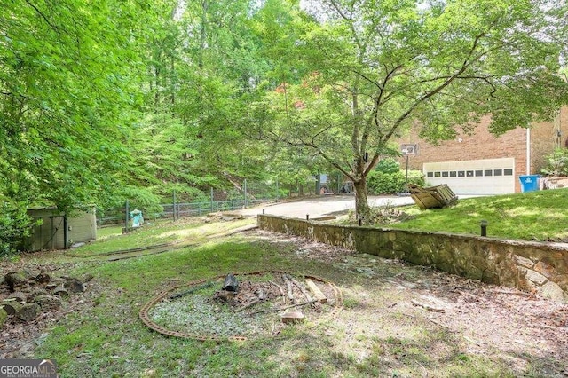 3493 Wood Acres Blvd, Duluth, GA 30096 - view of yard with a garage
