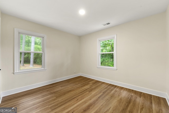 381 Warner St SE, Marietta, GA 30060 - empty room featuring baseboards and wood finished floors
