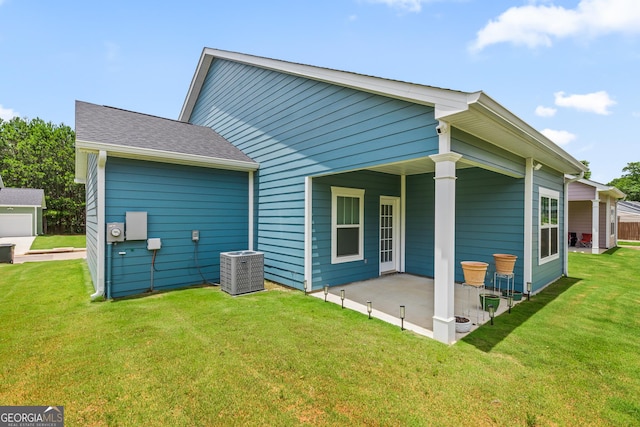118 Lenox Cir, Lagrange, GA 30241 - rear view of house with a patio area, a lawn, central air condition unit, and a shingled roof