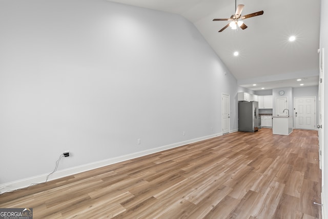 118 Lenox Cir, Lagrange, GA 30241 - unfurnished living room featuring high vaulted ceiling, ceiling fan, a sink, recessed lighting, and light wood-style floors