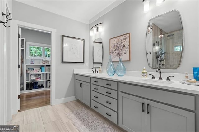 100 Yunsoo Pl E, Big Canoe, GA 30143 - bathroom featuring double vanity, a tile shower, and baseboards