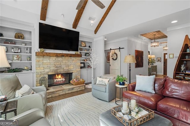 100 Yunsoo Pl E, Big Canoe, GA 30143 - living area with wood finished floors, a barn door, a fireplace, ceiling fan, and recessed lighting