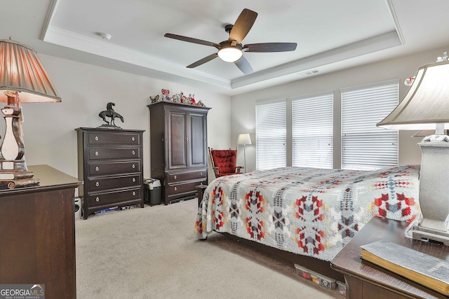 819 Firefly Ct, Griffin, GA 30223 - bedroom with a tray ceiling, carpet flooring, ornamental molding, and ceiling fan