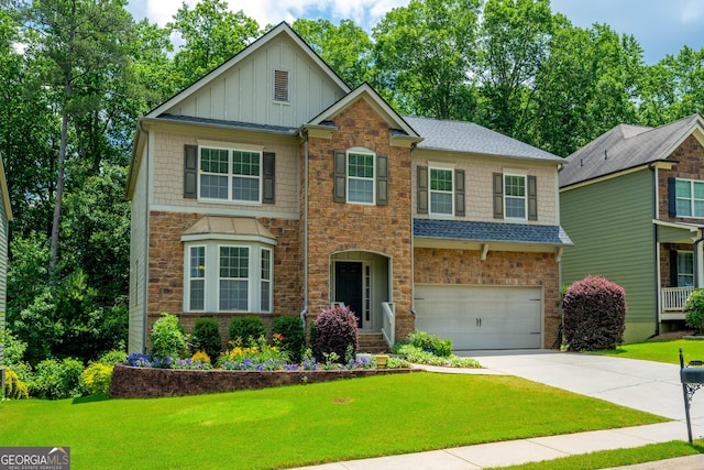 4540 Fourth Rail Ln, Cumming, GA 30040 - craftsman inspired home featuring a garage, driveway, a front lawn, and board and batten siding