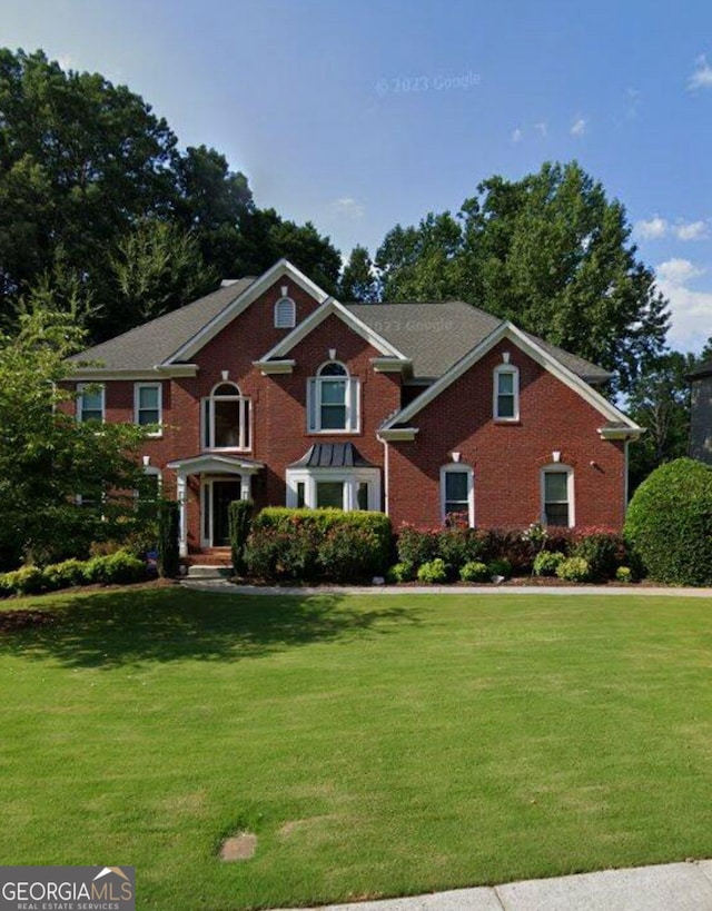 4265 Lansmoore, Suwanee, GA 30024 - view of front of house with a front lawn and brick siding
