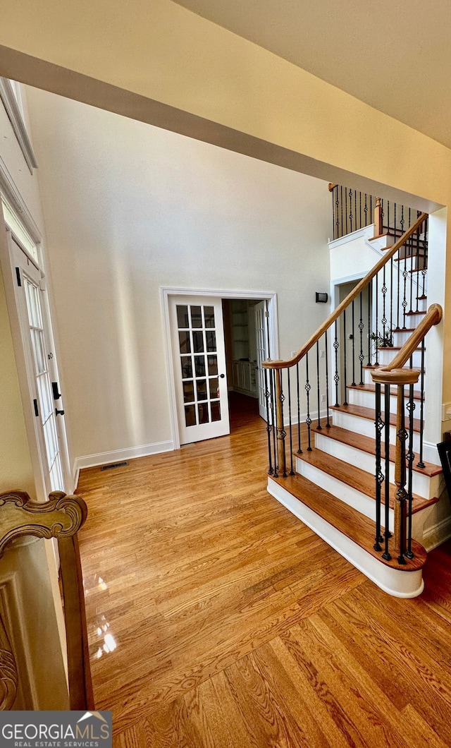 4265 Lansmoore, Suwanee, GA 30024 - foyer with wood finished floors, stairs, and french doors