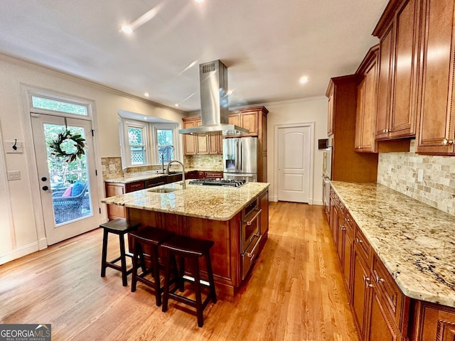 4265 Lansmoore, Suwanee, GA 30024 - kitchen with stainless steel appliances, ventilation hood, crown molding, an island with sink, and a breakfast bar area