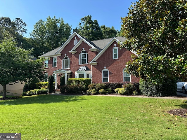 4265 Lansmoore, Suwanee, GA 30024 - view of front of property featuring brick siding and a front yard
