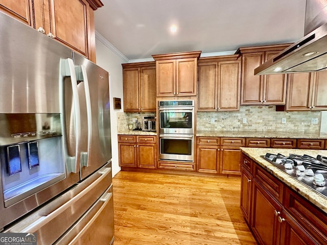 4265 Lansmoore, Suwanee, GA 30024 - kitchen with appliances with stainless steel finishes, extractor fan, crown molding, light wood-type flooring, and decorative backsplash