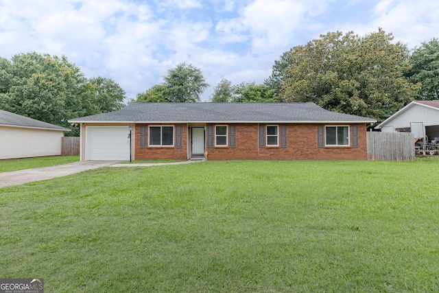 1027 Carl Vinson Pkwy, Centerville, GA 31028 - ranch-style house featuring driveway, a garage, brick siding, and a shingled roof