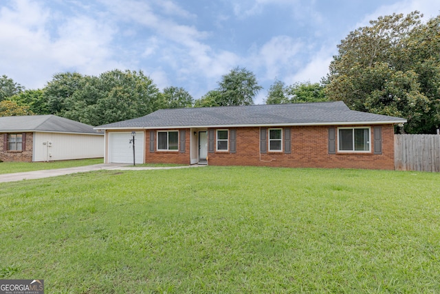 1027 Carl Vinson Pkwy, Centerville, GA 31028 - single story home with driveway, an attached garage, brick siding, and roof with shingles